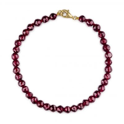 “Indian Garnet Gemstone Bracelet with faceted deep red garnets and precious metal clasp.”