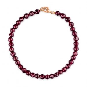 “Indian Garnet Gemstone Bracelet with faceted deep red garnets and precious metal clasp.”
