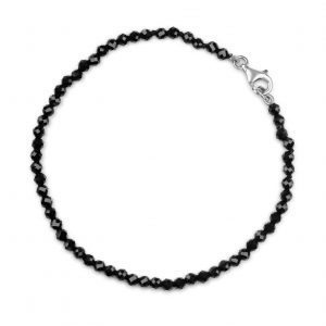 “Onyx Gemstone Bracelet with faceted black onyx beads and precious metal clasp.”