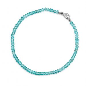 “Blue Apatite Gemstone Bracelet with faceted blue apatite beads and precious metal clasp.”